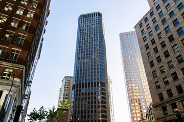 Fototapeta premium Modern skyscrapers in a financial district at sunset, bottom view, real estate and success concept, USA