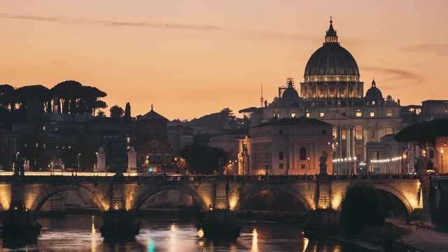 Vatican, Italy. Papal Basilica Of St. Peter In The Vatican And Aelian Bridge In Evening Night Illuminations. Day To NIght Time Lapse. Sunset Time