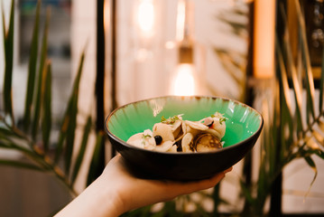 Small pancakes in a plate with berries and homemade sour cream, desserts in a cafe, children's menu, selective focus