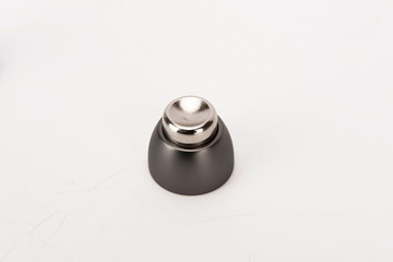 Various metal door stop tools on white background