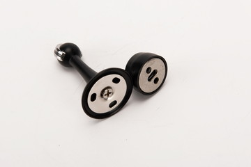 Various metal door stop tools on white background