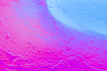 Beautiful bright colorful street art graffiti background. Abstract creative spray drawing fashion colors on the walls of the city. Urban Culture, black ,blue, purple , violet , neon texture