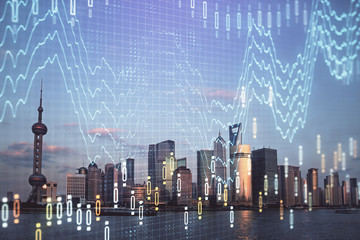 Forex graph on city view with skyscrapers background double exposure. Financial analysis concept.