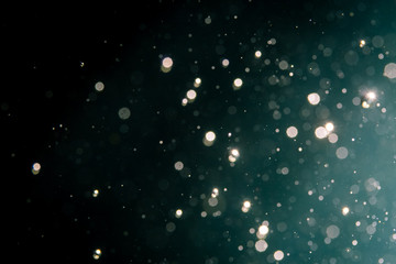 Abstract blur glitter bokeh on black