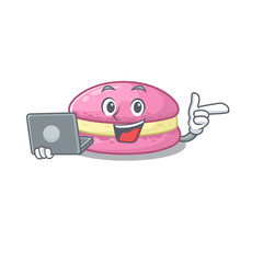 Cool character of strawberry macarons working with laptop