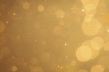 Dark Abstract Gold bokeh sparkle on black background