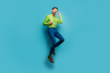 Fototapeta na wymiar Full length body size view of his he nice attractive funky satisfied cheerful cheery excited guy jumping celebrating isolated on bright vivid shine vibrant blue green teal turquoise color background