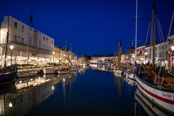 Night view of the port canal designed by Leonardo da Vinci and old town of Cesenatico on the Adriatic sea coast