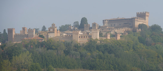 Panorama of Gradara village with walls, towers and the fortress on the hill over the the green countryside