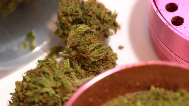 Tilt down of marijuana buds and grounds