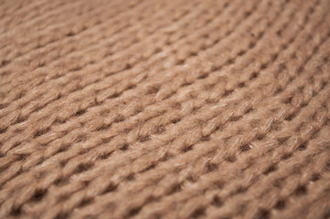 Closeup of brown woolen pullover texture