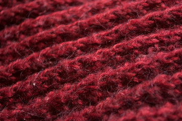 Closeup of red woolen pullover texture