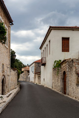 Fototapeta na wymiar Street with stone houses in the village close-up