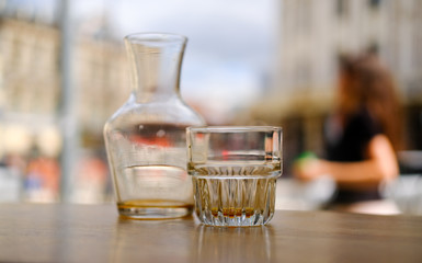 Drunk coffee filter. An empty glass decanter and an empty glass cup from under a coffee filter. Aesthetics coffee