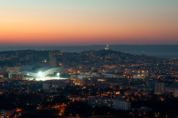 Panoramic shot of the city of Marseille and Orange Velodrome stadium at sunset and golden hour from...