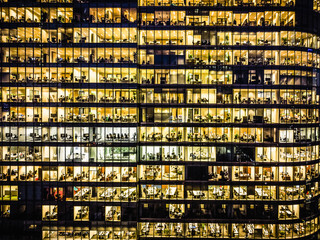 Employees in offices, modern glass office building