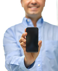 business, people and technology concept - close up of happy smiling businessman showing smartphone black blank screen