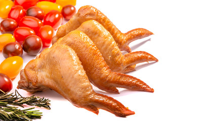 smoked chicken wings, cherry tomatoes on a white isolated background
