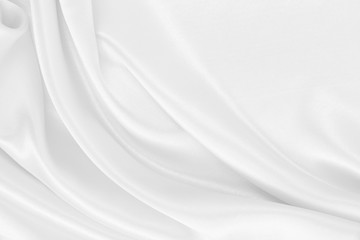 Fototapeta na wymiar Smooth elegant white silk or satin luxury cloth texture as wedding background. Luxurious background design