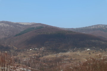 mountains lit by the day sun