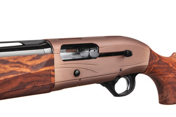 Left-handed shotgun. Hunting semi-automatic shotgun with a wooden butt and forearm isolated on white back. Convenient weapons for hunting and sports.