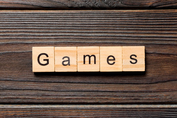 games word written on wood block. games text on table, concept