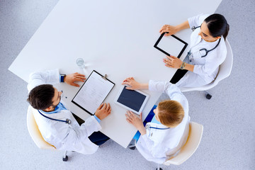 Group of doctors with gadgets in hospital , top view