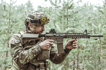 Handsome man in italian military uniform camouflage coloring Digital Vegetato