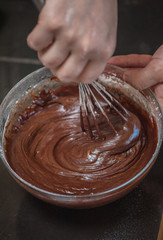 Chocolate Dessert dough cooking in glass bowl. Home cooking