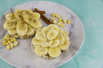 Sandwich with coconut paste, bananas with cinnamon and peanuts