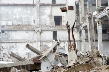 The remains of a large building destroyed in a foggy haze. Background.