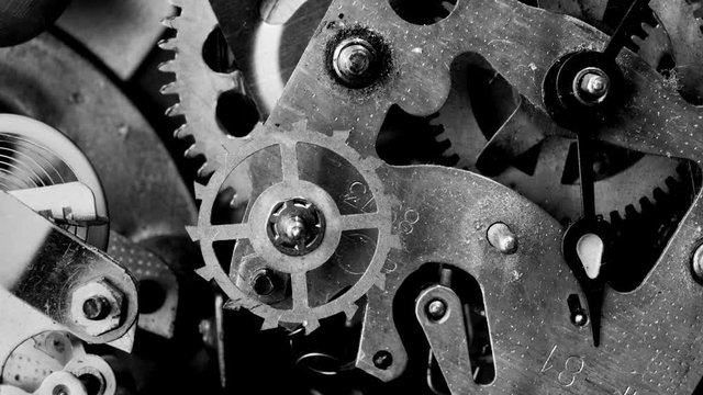 Watch mechanism macro loop.Old vintage clock mechanism working, closeup shot with soft focus.Close up of a internal clock mechanism.Vintage Watch Gears Movement Macro.