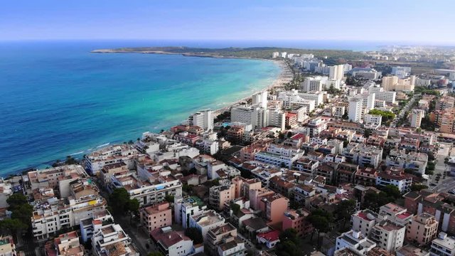 Aerial view of Cala Millor mediterranean village in the east coast of the Island of Mallorca. Dolly in