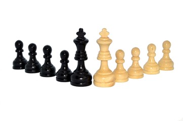 White king versus black king against the unfocused pawns isolated on white background. Business metaphor