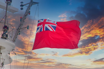 Red, white and blue flag British Navy flag blowing from mast on a ship