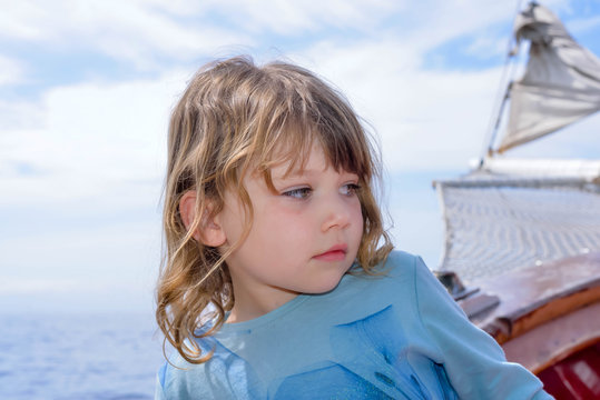 beautiful little girl visiting Los gigantes in Tenerife on an old sailing ship