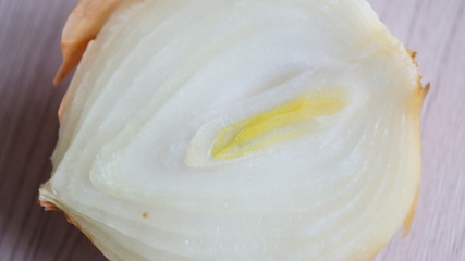 Fototapeta na wymiar Onion surface cut in half with a knife
