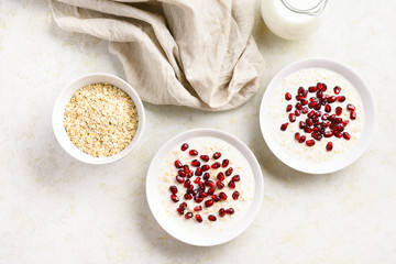 Obraz na płótnie Canvas Oats porridge pomegranate seeds