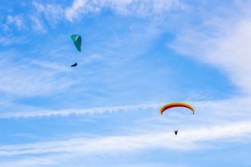 Skydiver On Colorful Parachute In Sky. Active Hobbies