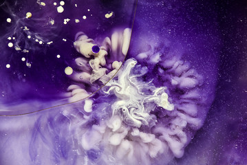 Beautiful abstraction in shades of blue and purple of liquid paints © dominikab