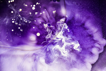 Beautiful abstraction in shades of blue and purple of liquid paints © dominikab