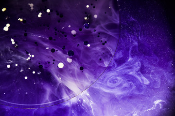 Beautiful abstraction in shades of blue and purple of liquid paints © dominikab