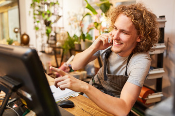 Florist on the phone accepts order