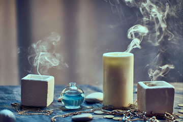 Group of magic smoke candles and a bottle elixir potion for a divination occult spell witchcraft...