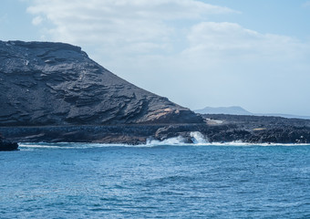 The surf on volcanic black beach El Golfo, island Lanzarote