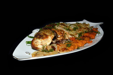 fried fish isolated on black background