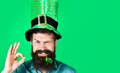 Okay gesture. Smiling man in Leprechaun hat show sign ok. Green hat with clover. Saint Patrick...