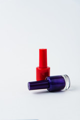 colored nail polishes on a white background