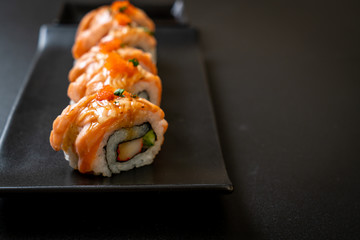grilled salmon sushi roll with sauce