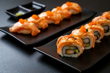 grilled salmon sushi roll with sauce